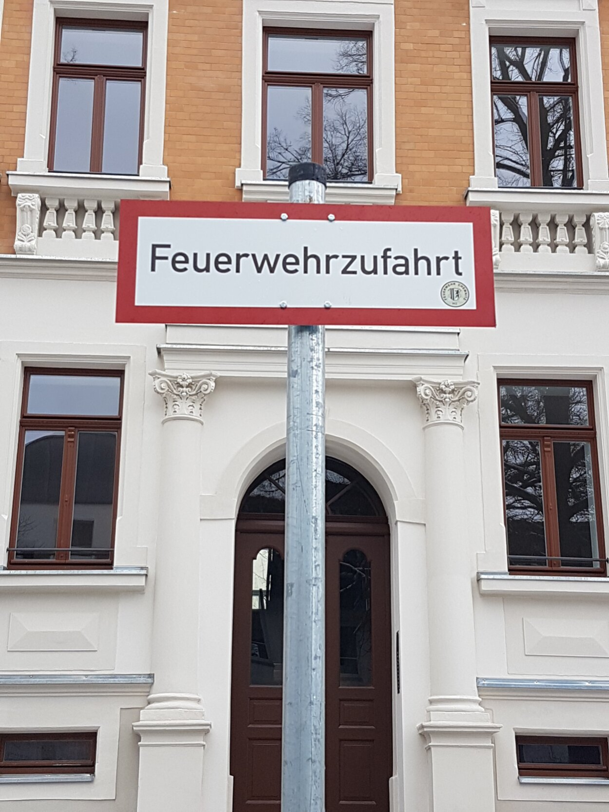 Sign with "Fire brigade access" printed on it